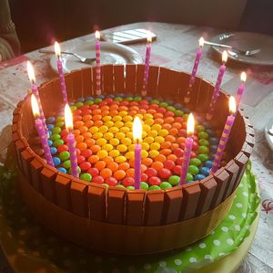 Multi colored cake on table