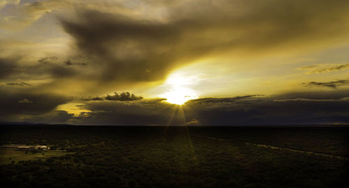 Scenic view of sunset over land