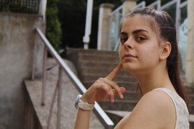 Portrait of young woman looking away