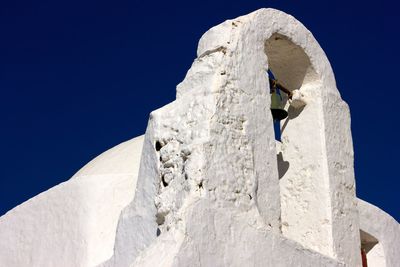 Low angle view of mountain against clear blue sky