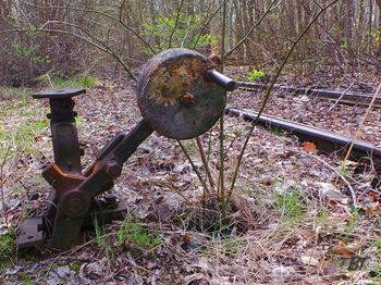 Old rusty metallic structure on field