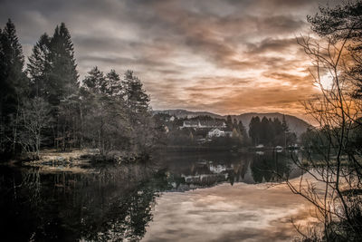 Scenic view of lake against sky during sunset