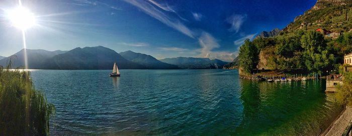 Scenic view of calm sea against mountains