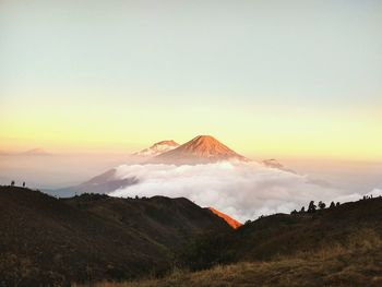 View of volcanic landscape against sky during sunset