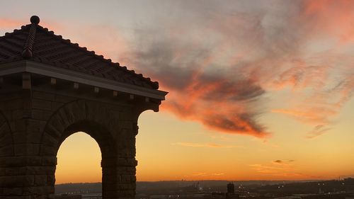 Low angle view of sunset over city