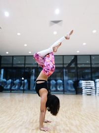 Full length of woman dancing in studio