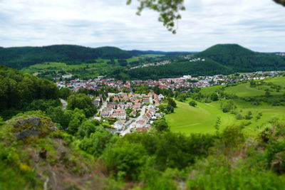 Aerial view of townscape and trees against sky in albstadt