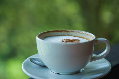 Close-up of coffee cup on table