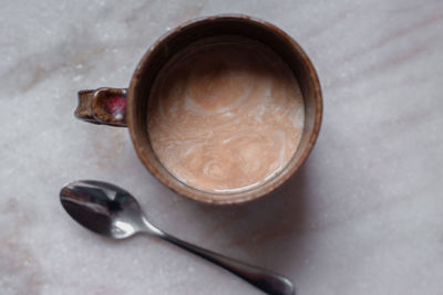 High angle view of coffee cup on table