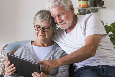 Man and woman sitting on table
