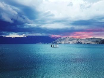 Scenic view of lake against sky during winter