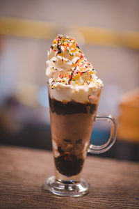 Close-up of ice cream in glass on table