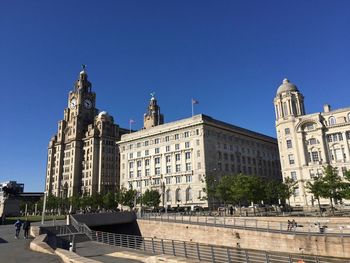 Low angle view of building against blue sky