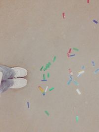 Close-up of shoes on tiled floor