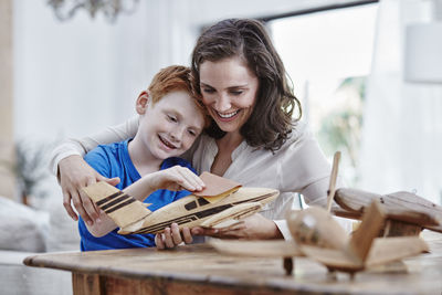 Mother and son with model airplanes