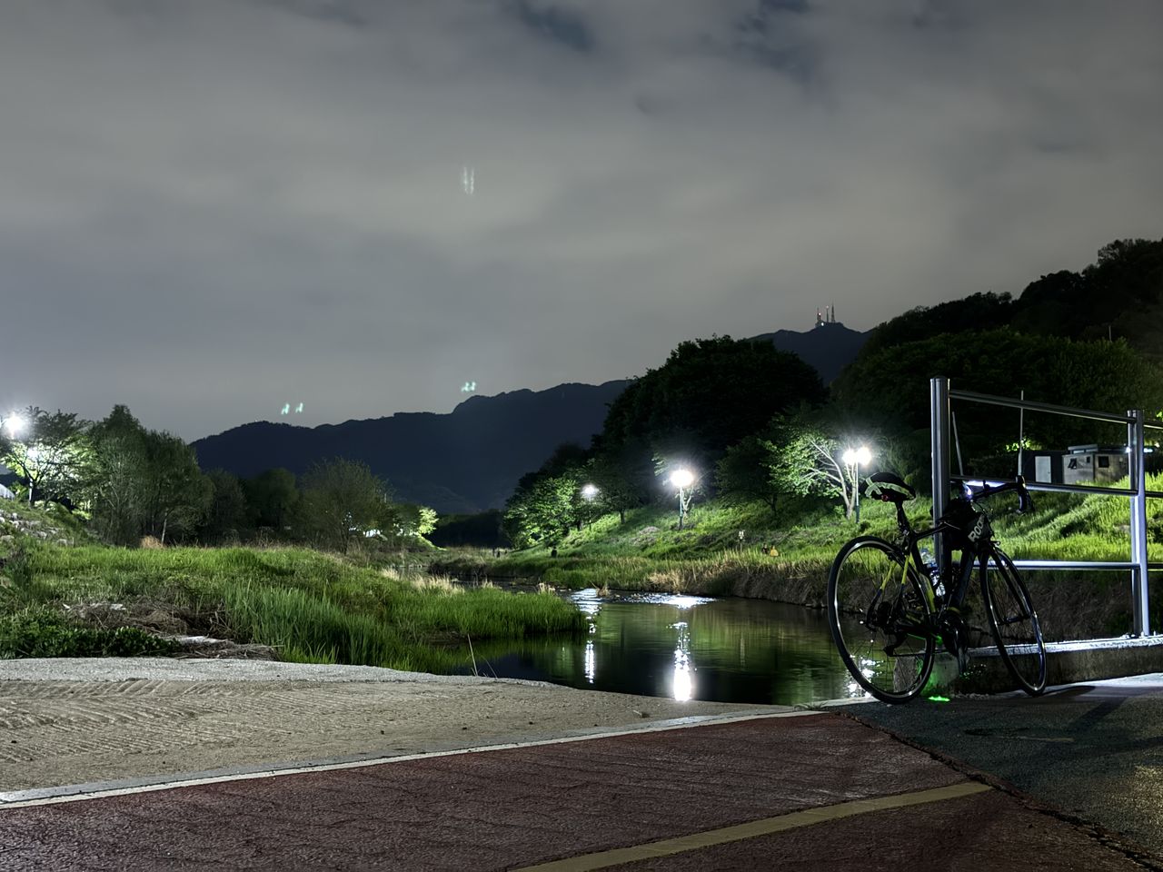 sky, cloud, night, bicycle, nature, tree, water, transportation, plant, no people, mountain, illuminated, scenics - nature, architecture, light, environment, beauty in nature, morning, outdoors, tranquility, street, land, road, tranquil scene, reflection, city