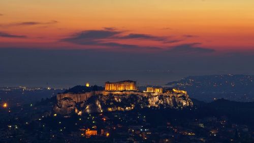 High angle view of illuminated acropolis temple against sky at dusk