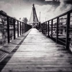 View of bridge against cloudy sky