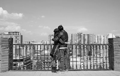 Monochrome image of couple embracing at the view point of santa lucia hill, santiago, chile