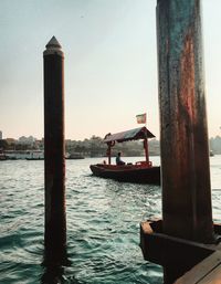 Boat sailing on sea against sky