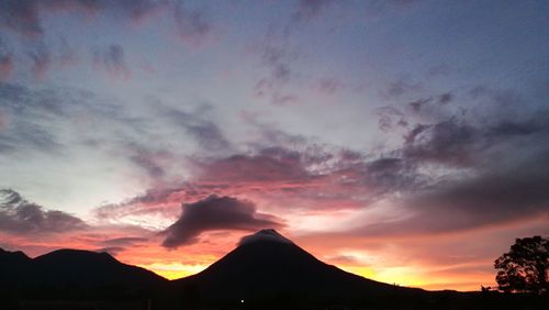 Silhouette mountains against sky during sunset