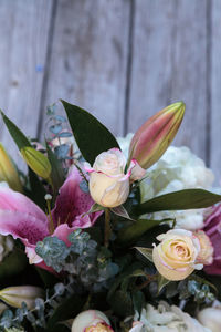 High angle view of various flowers on floorboard