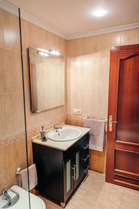 Interior of bathroom with washbasin cabinet and mirror