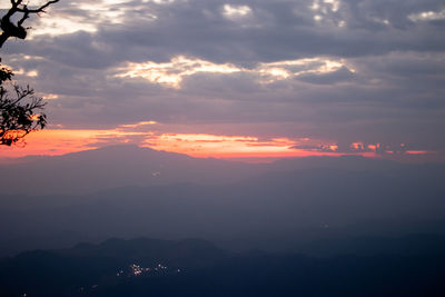 Scenic view of silhouette mountains against sky during sunset
