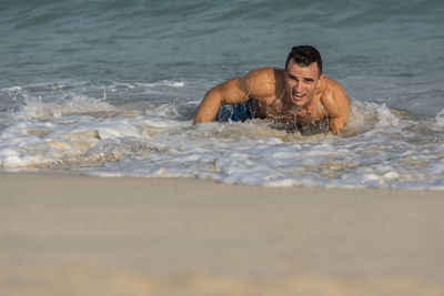 Portrait of young man in sea