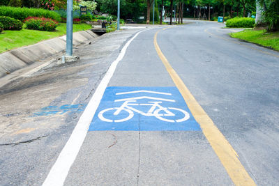 High angle view of markings on bicycle lane