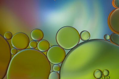 Close-up of oil bubbles in water