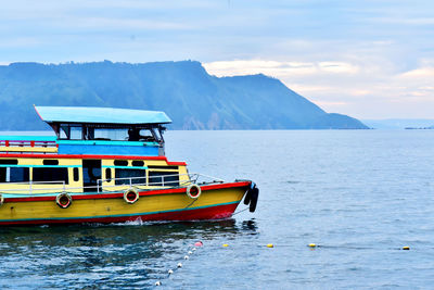 Boat in sea against sky