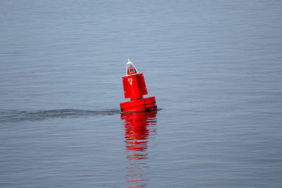 Red floating on water