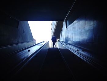 Full length of woman walking on footbridge