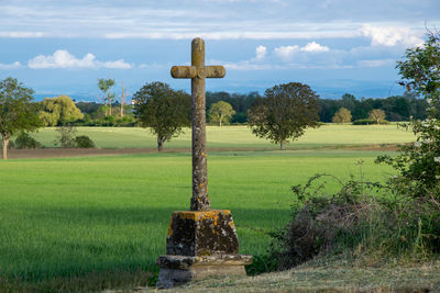 Built structure on field against sky