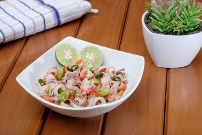 High angle view of salad in bowl on table