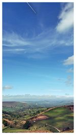 Scenic view of landscape against cloudy sky