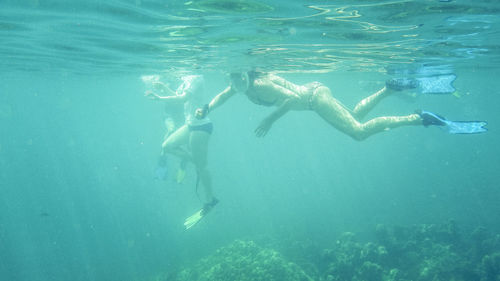 People swimming in sea