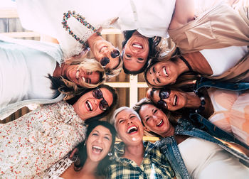 Portrait of happy women standing in circle