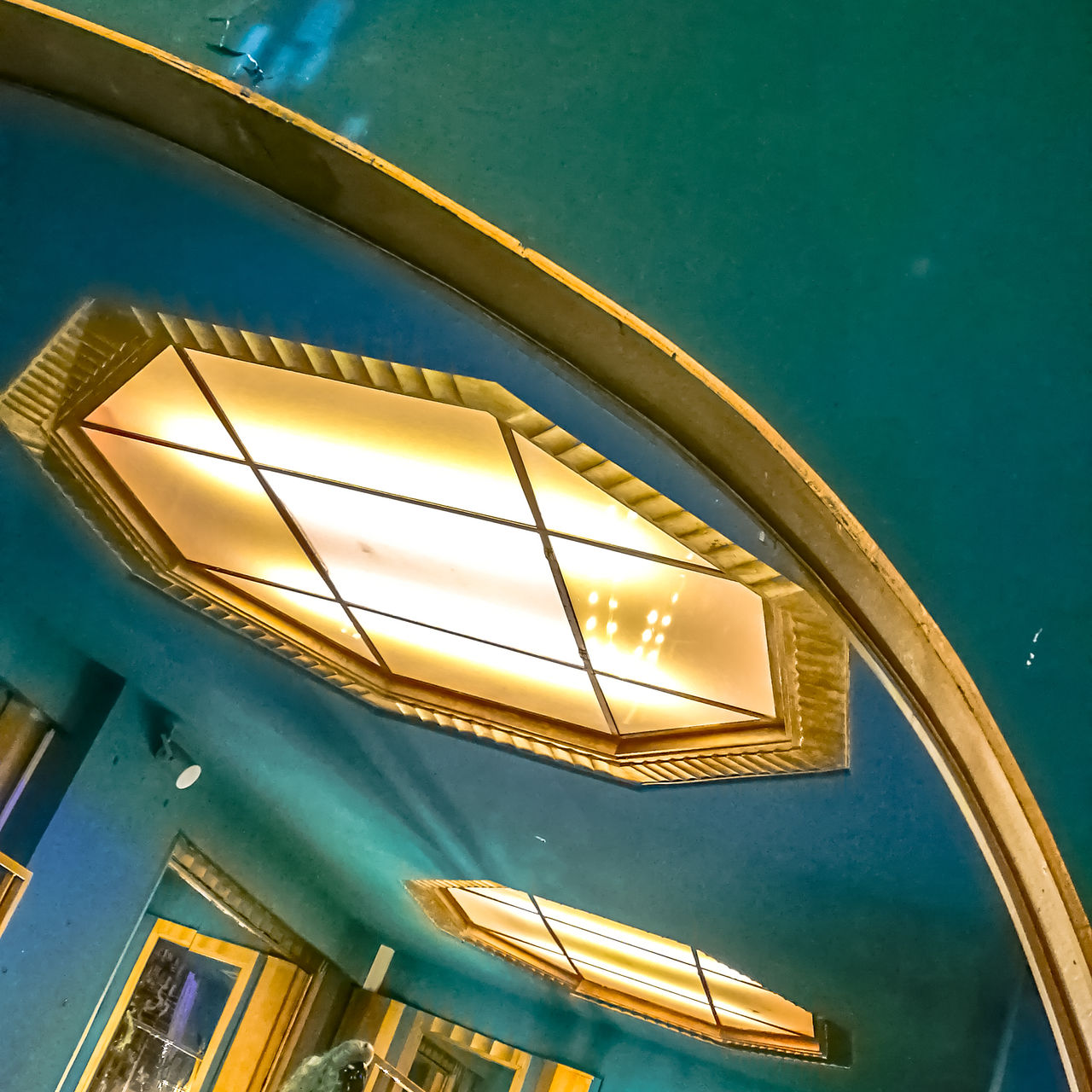 LOW ANGLE VIEW OF ILLUMINATED LIGHTING EQUIPMENT IN SWIMMING POOL