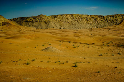 Scenic view of desert against sky