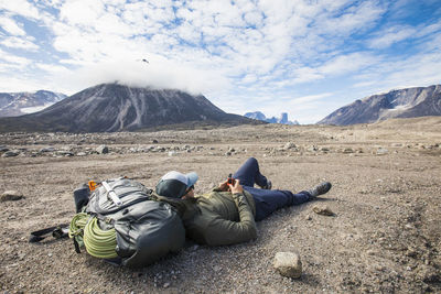 Man uses gps navigation device to map out his travel route