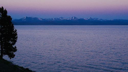 Scenic view of sea against sky at dusk