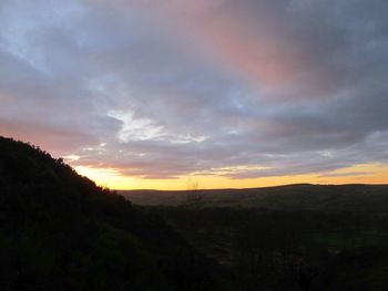 Scenic view of silhouette landscape against sky during sunset