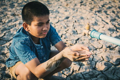 Close-up of boy holding leaf