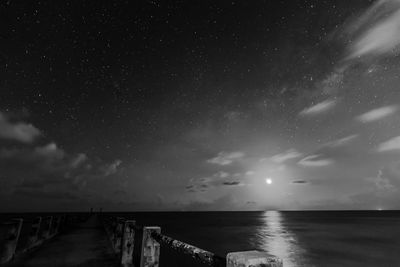 Scenic view of sea against sky at night