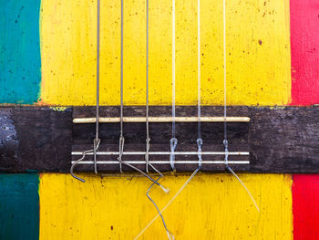 Close-up of yellow wood guitar