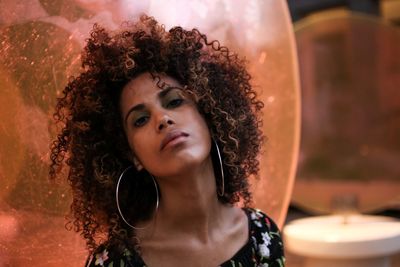 Portrait of young woman with curly hair