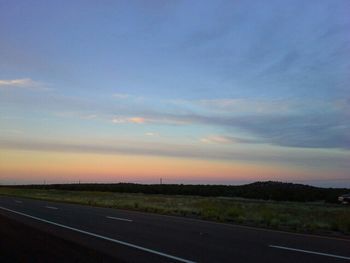 Road passing through field