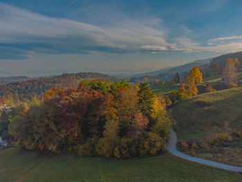 Trees on landscape against sky during autumn